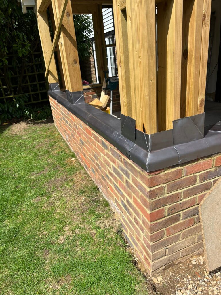 Lead Capping over Brickwork